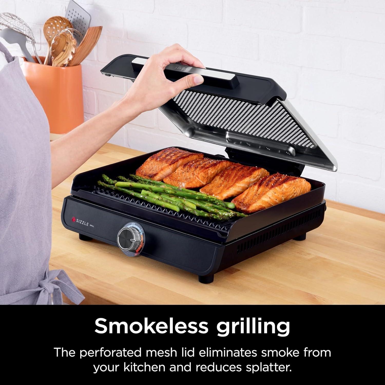 imageNinja GR100 Sizzle Smokeless Indoor Grill with Nonstick Grill Plate DishwasherSafe Removable Mesh Lid 500F Max Heat Even EdgetoEdge Cooking Black RenewedSizzle Indoor Grill